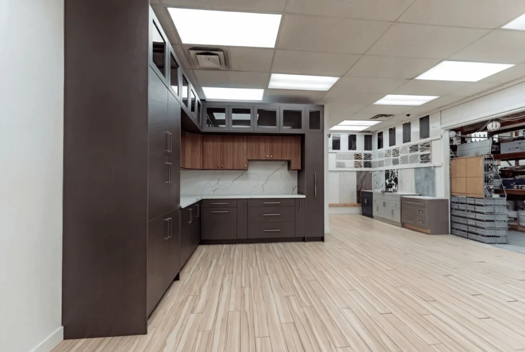 Tevola display kitchen with dark wood cabinets inside CTS Building Supplies on Progress Ave