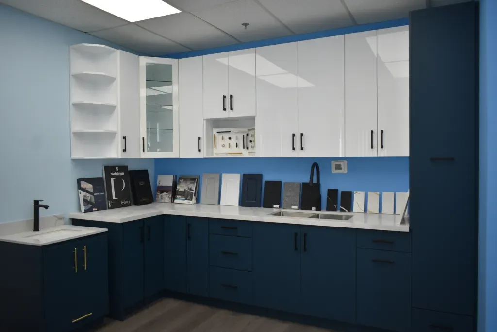 Tevola showroom kitchen at 50 Thornmount Dr with navy lower cabinets, white uppers and finish samples